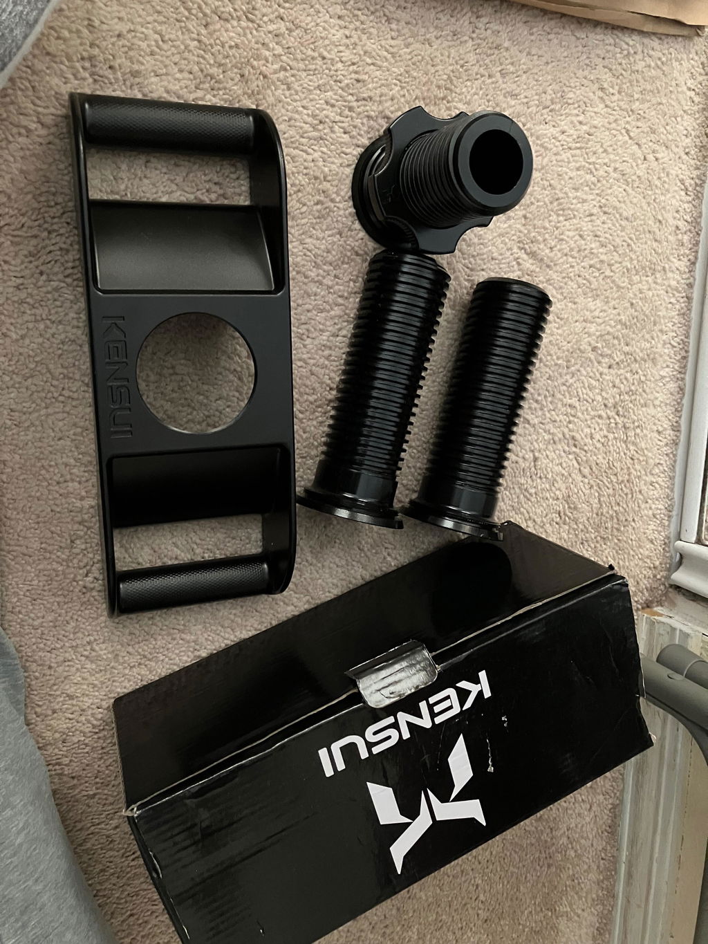 Neck harness straps and loading posts beside their box